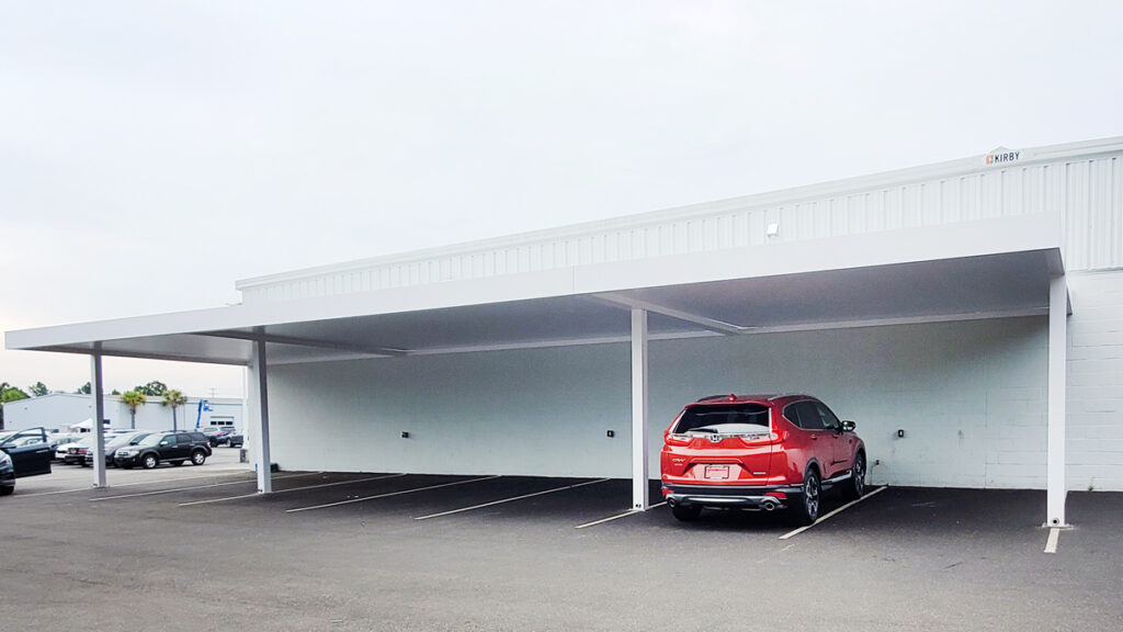 R-Car carport cover on commercial parking lot