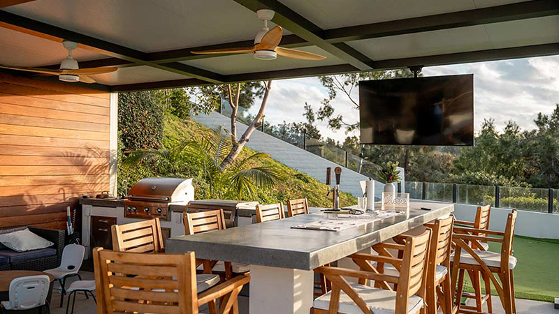 Modern insulated roof custom pergola with outdoor kitchen and TV- The Louvered Pergola, in Indiana